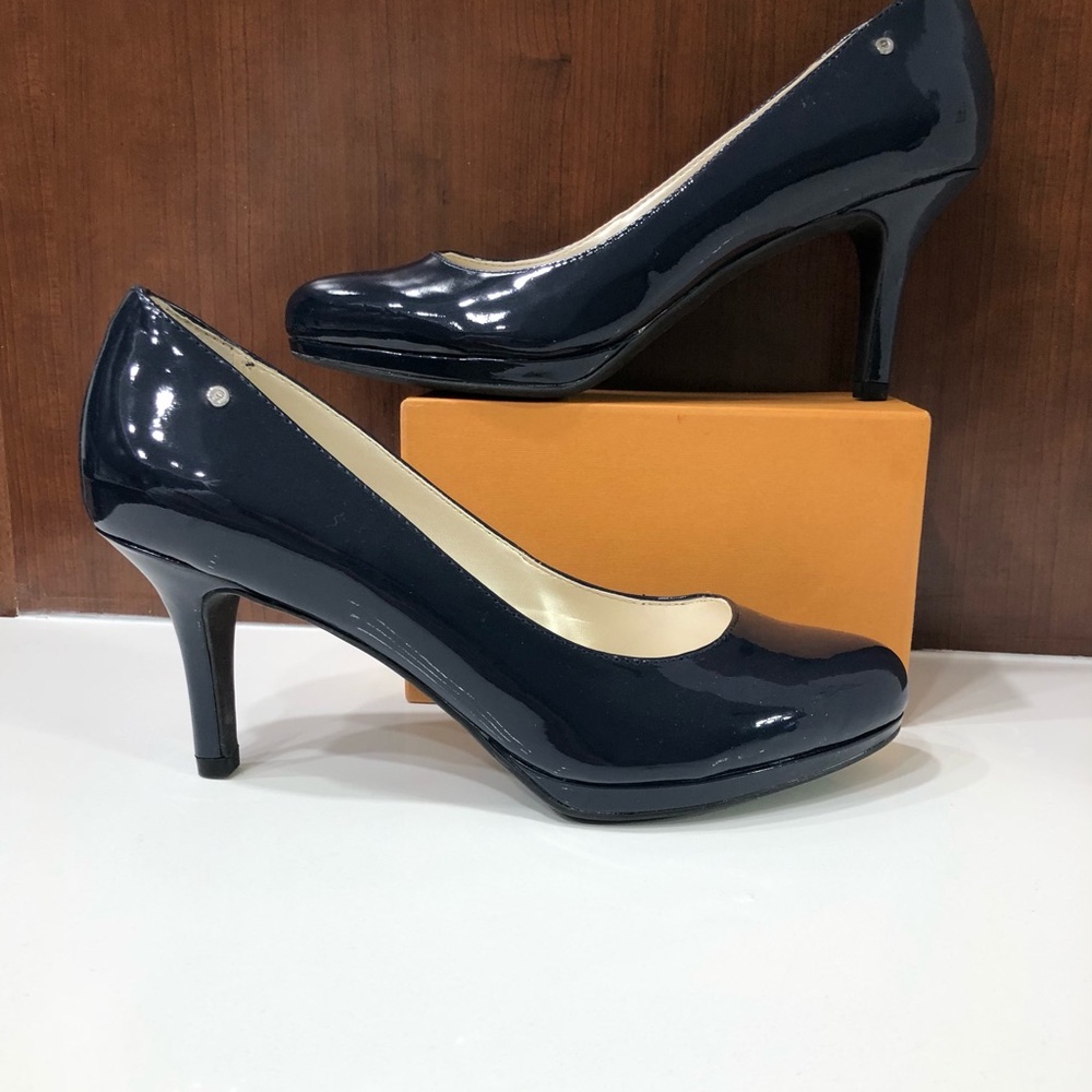 Blue Etienne Aigner E-Drew patent leather pumps.